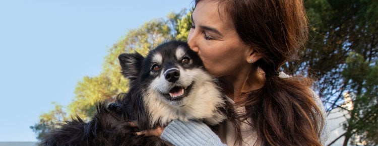 A dog and its owner showing just how much they love each other.