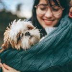 Couple hugging deaf dog