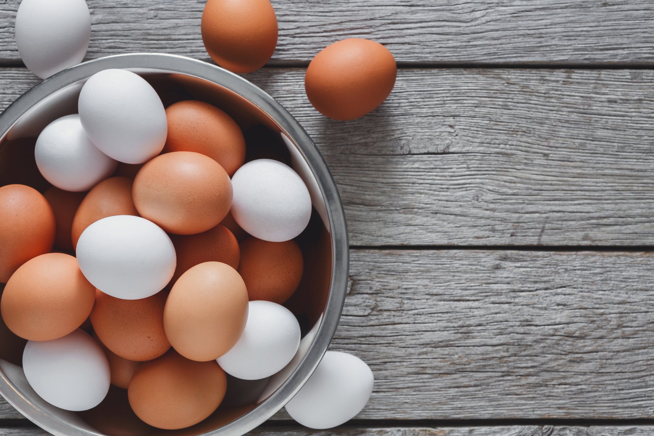 white and brown eggs in bowl