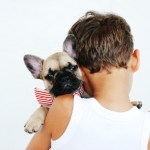 boy holding dog