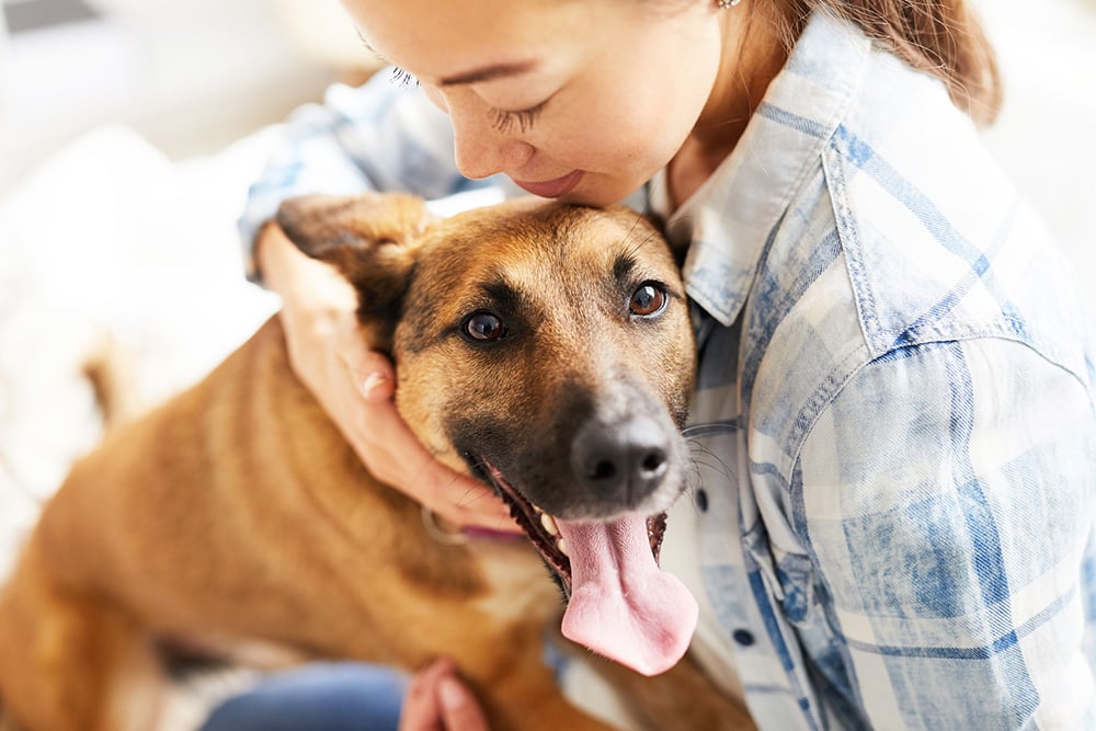 Woman holding a dog