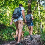 couple hiking with dog