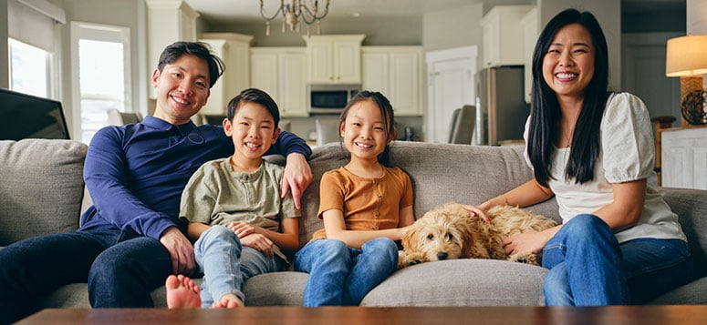 Family with dog on couch.