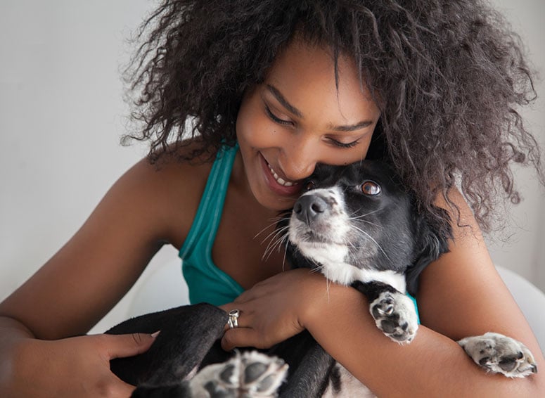 Woman hugging dog